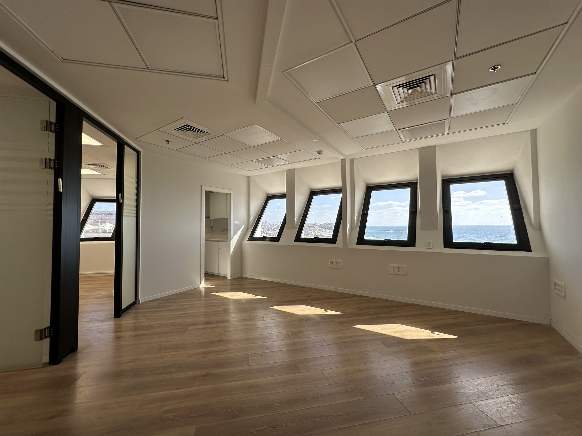 Open-plan office looking out to the private courtyard